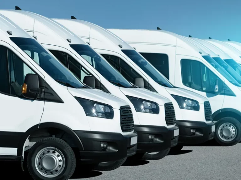 row of white vans specilised for cargo transport